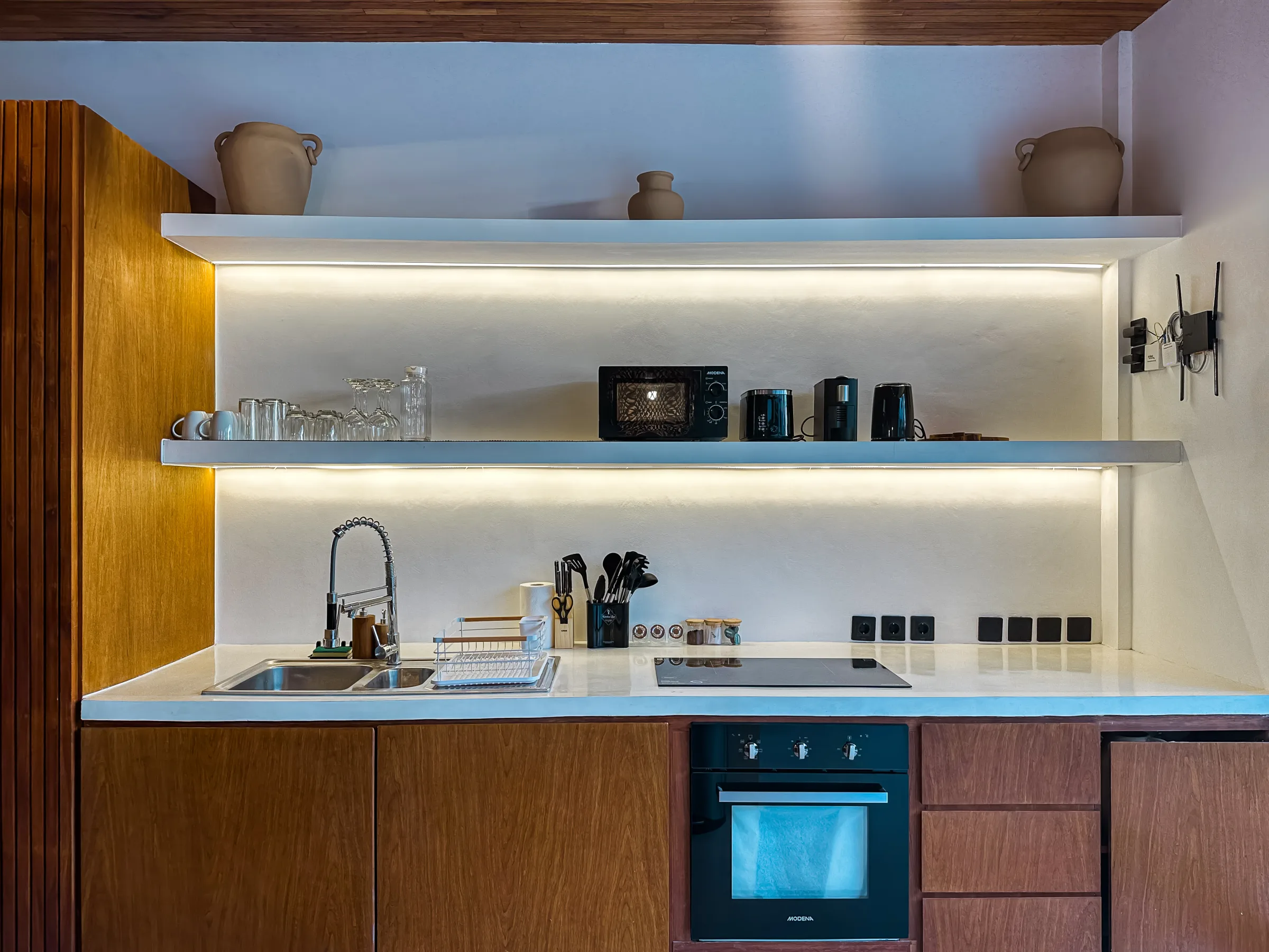 Casa Petak kitchen with pool view - where Balitecture's management team handles guest check-ins and turnover