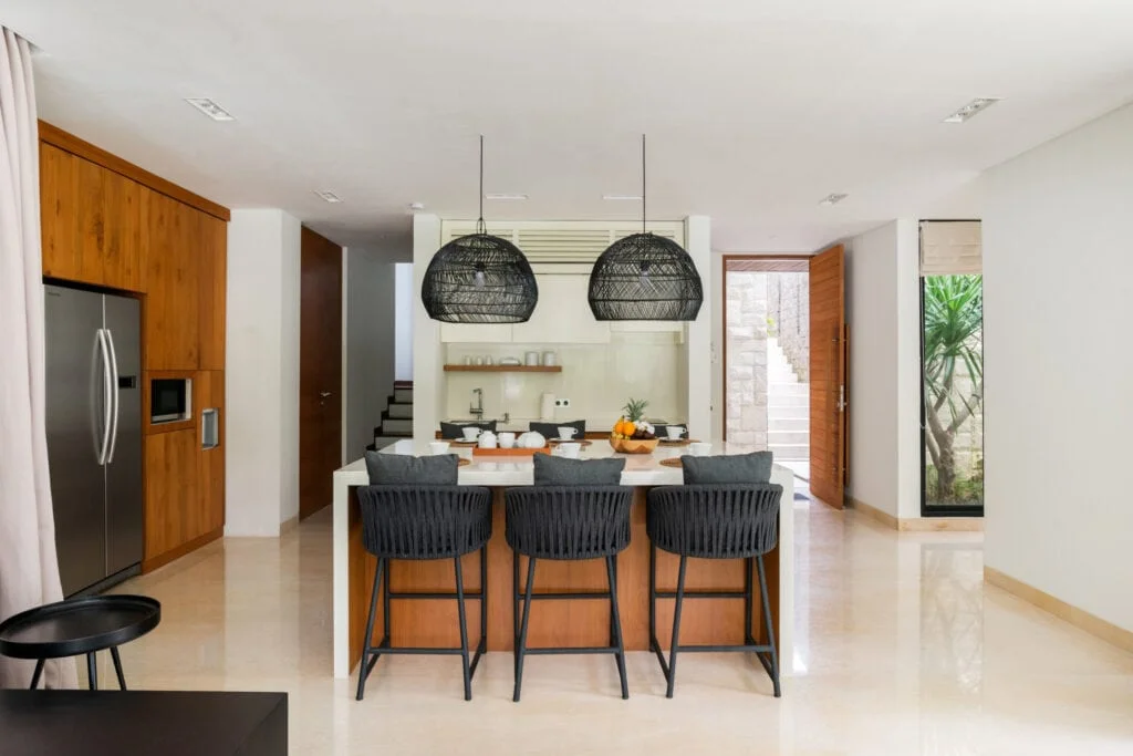 Completed Balitecture villa - open-plan kitchen and living area with island bench